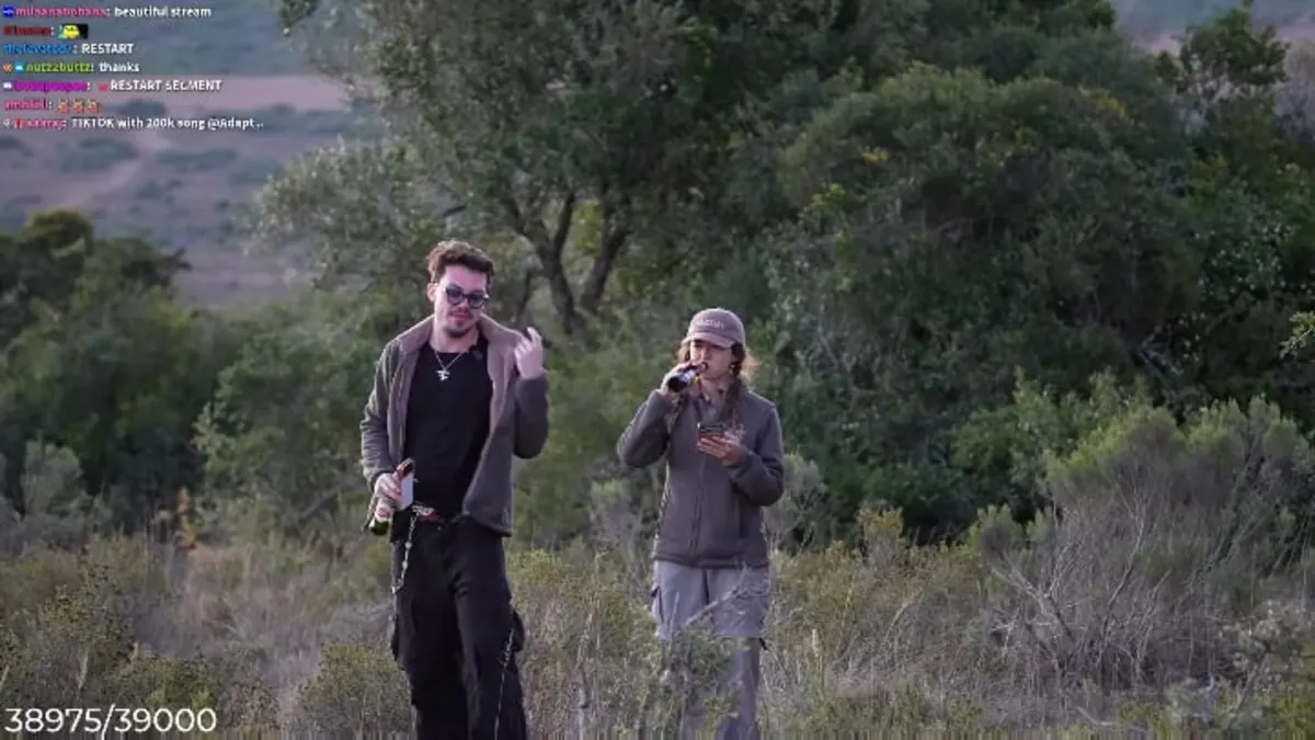 Two people walking outdoors with drinks