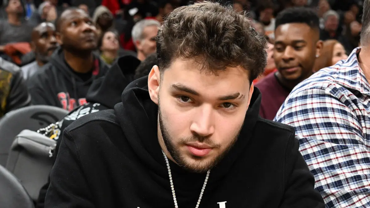 Man in black hoodie at sports event