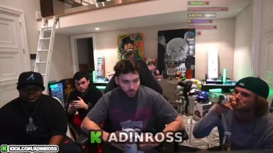 Streamers in a gaming room with posters.