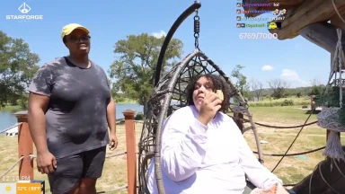 Two people outdoors, one eating, sunny day