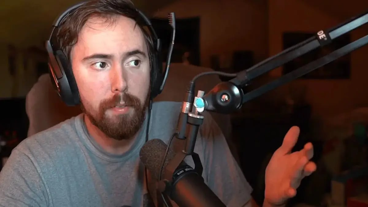 Man speaking into microphone wearing headset indoors