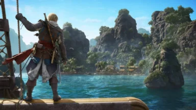 Adventurer overlooking tropical island from ship deck