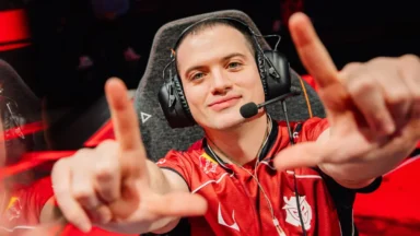 Esports player in headset makes a hand gesture
