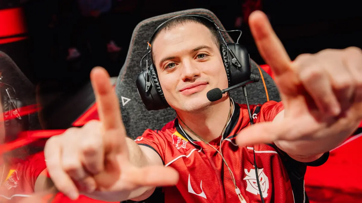 Esports player in headset makes a hand gesture