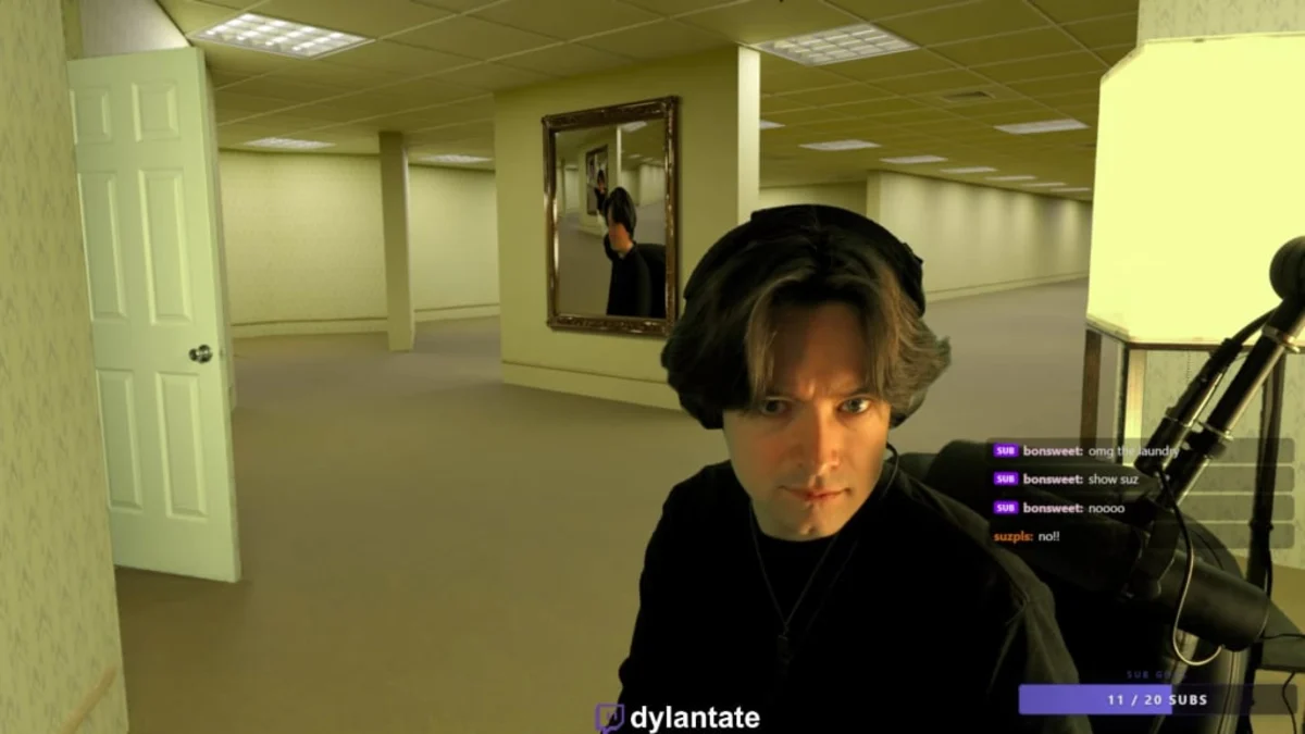 Streamer in empty office maze with mirror