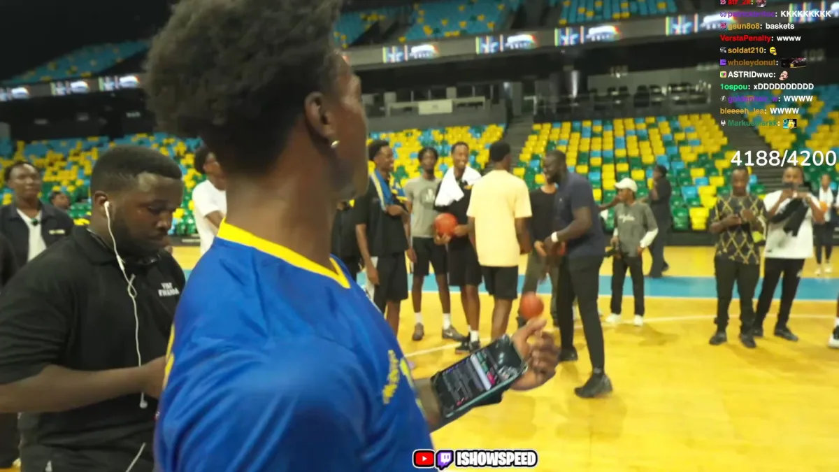 People playing basketball on indoor court