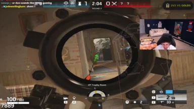 First-person shooter gameplay with scope and streamer facecam