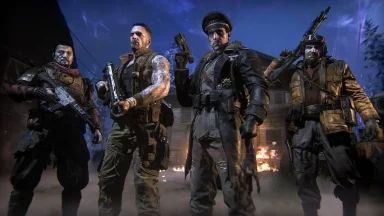 Armed soldiers standing in a war zone at night