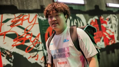 Young man in gaming jersey with backpack