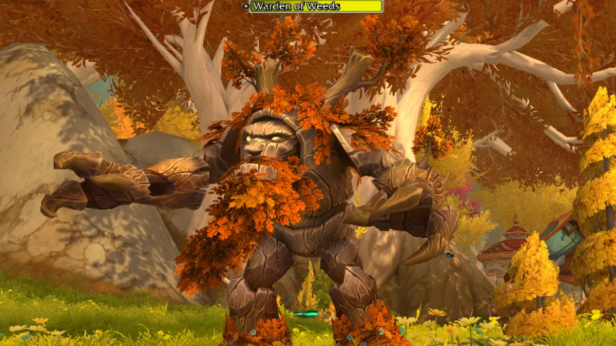 Tree creature with autumn leaves in fantasy forest
