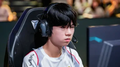 Focused esports player wearing headset at computer