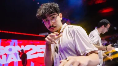 Esports player pointing at camera on stage