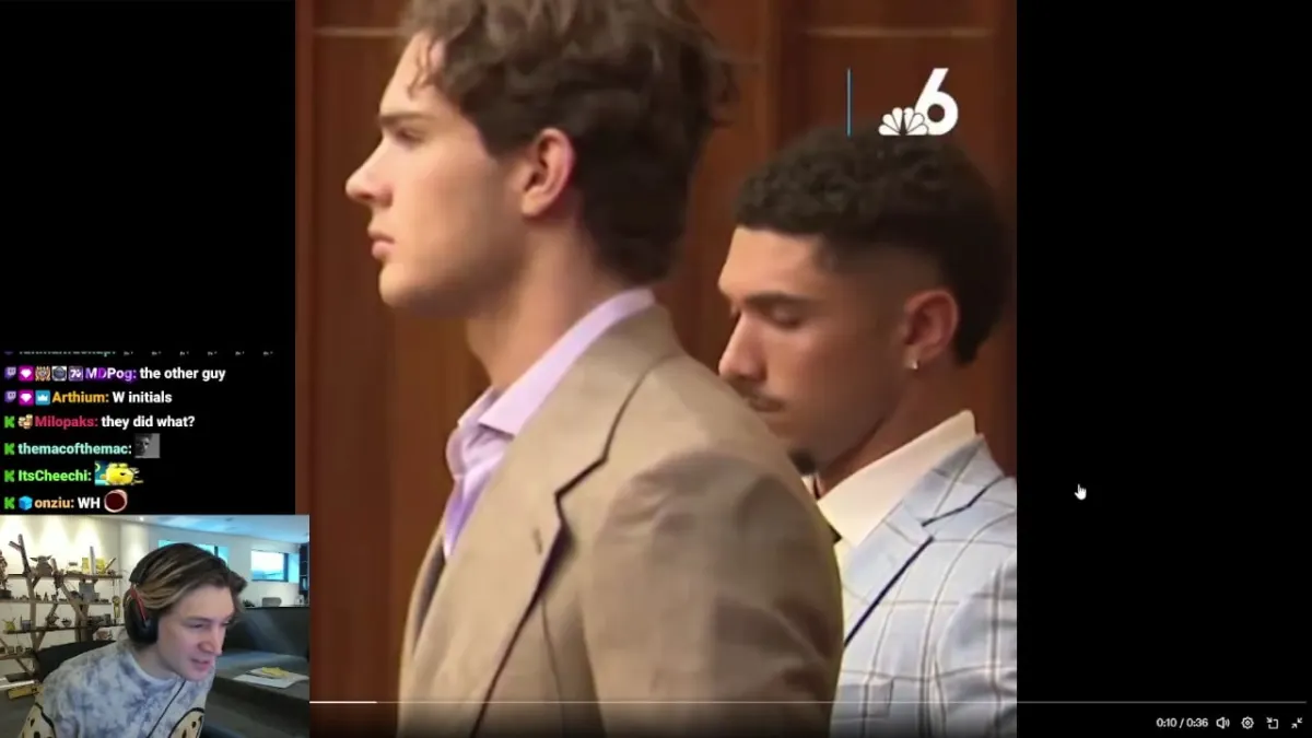 Two men in suits standing in courtroom