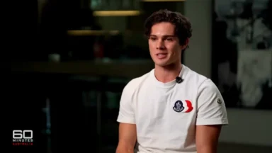 Man in white T-shirt during TV interview
