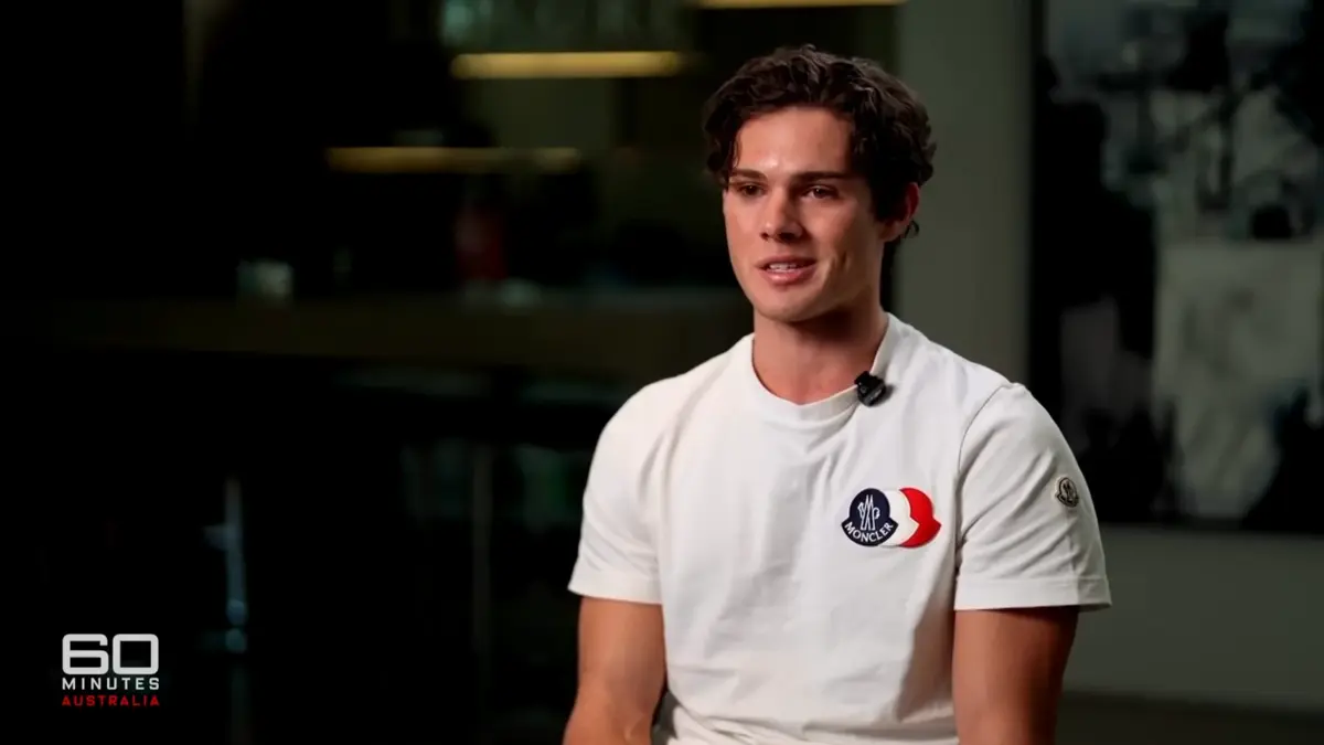 Man in white T-shirt during TV interview