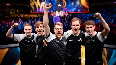 Esports team celebrating victory on stage