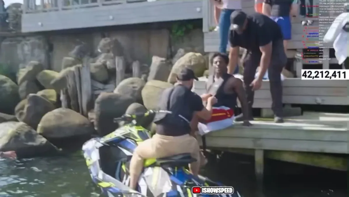 Person on dock helps another from watercraft.