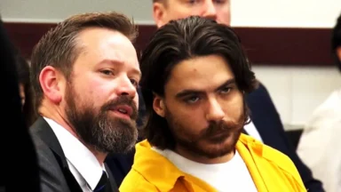 Attorney speaking with defendant in courtroom