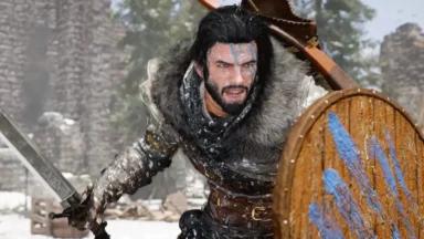Fur-clad warrior with sword and shield in snow