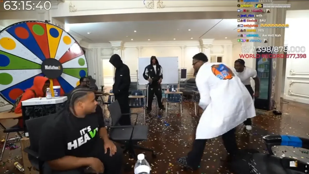 Group of people celebrating world record with confetti indoors
