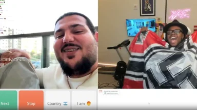 Two men video chatting, one holding a Nazi flag.