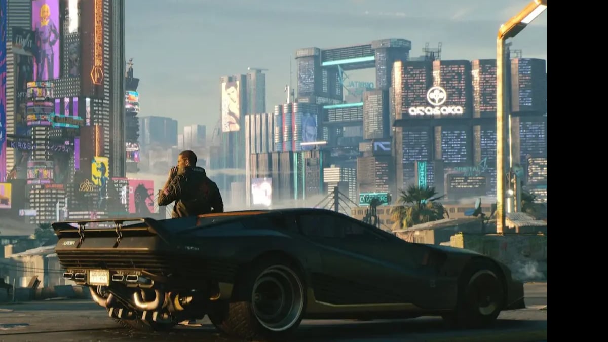 Man beside black sports car in neon futuristic city