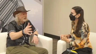 Two people talking during an interview at event