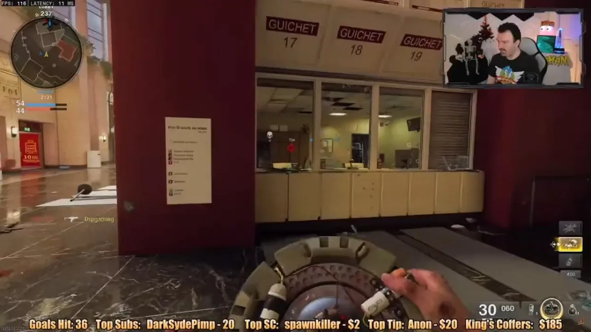 First-person shooter gameplay with streamer facecam overlay