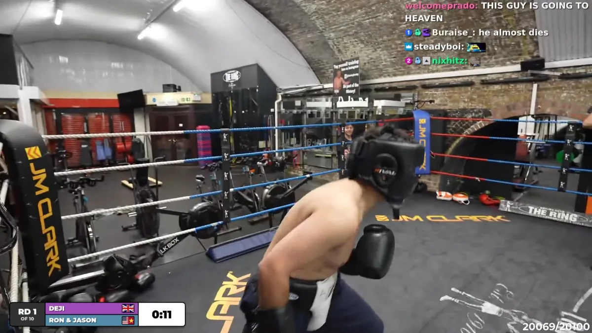Boxer wearing headgear inside gym boxing ring