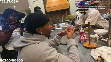 People talking in a kitchen during livestream recording.