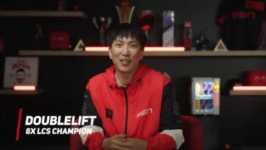Esports player in red jacket smiling on camera