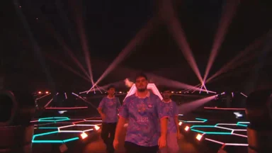 Esports team walking onto stage with dramatic lighting