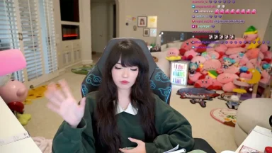 Streamer waving during live broadcast in cozy room