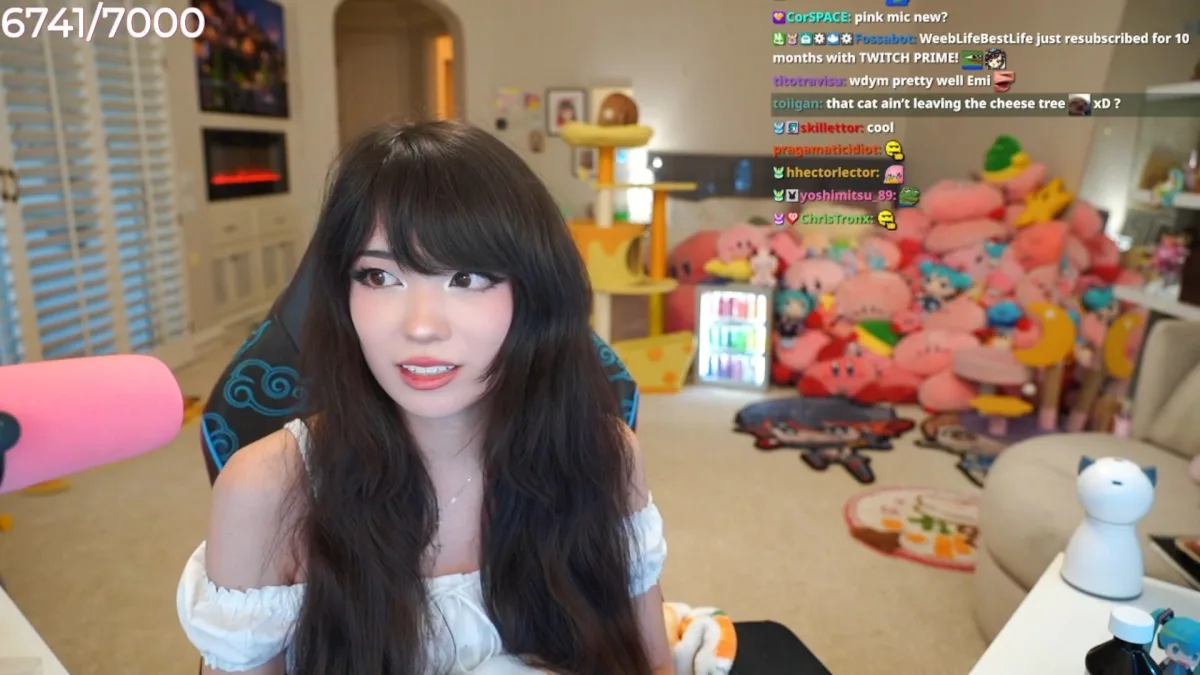 Streamer chatting in colorful gaming room with plushies.