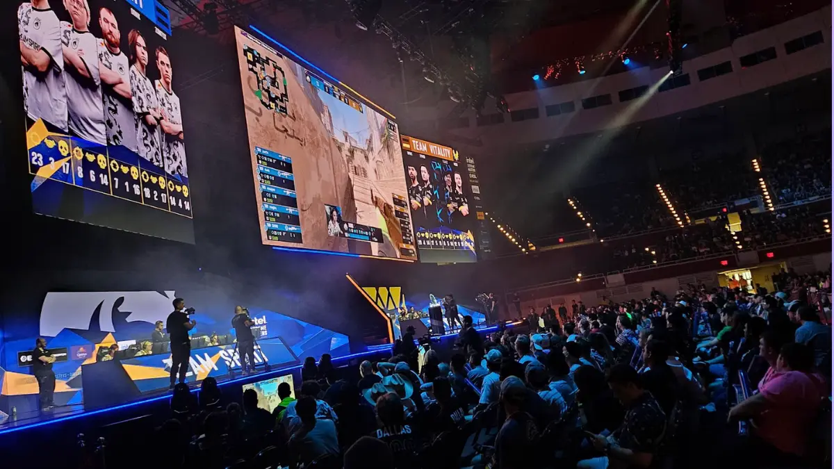 esports stage Esports tournament with live audience and large screens.