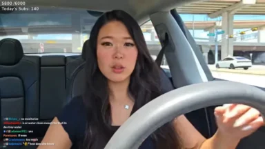 Woman livestreaming while driving car on highway