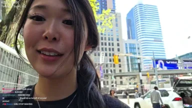 Woman taking selfie in downtown city street