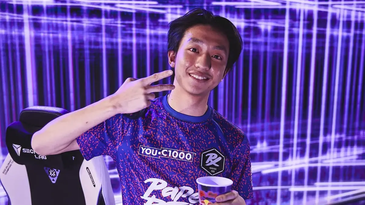 Man making peace sign in neon studio