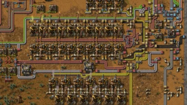Dense Factorio refinery with pipes, conveyors, and chemical plants
