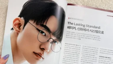 Magazine spread featuring man wearing round glasses