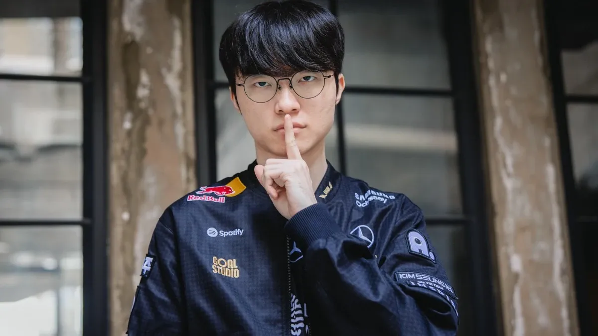 Esports player in team jacket makes shushing gesture
