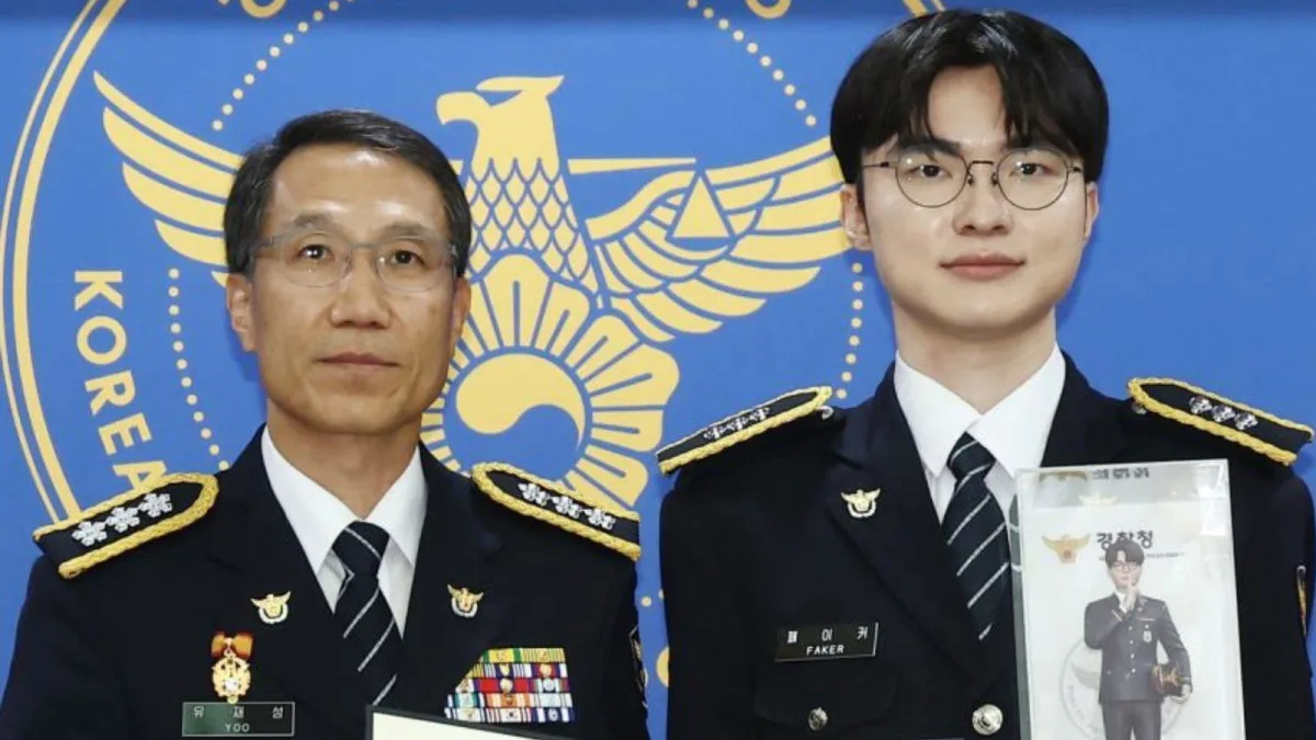 Two uniformed officers posing before police emblem