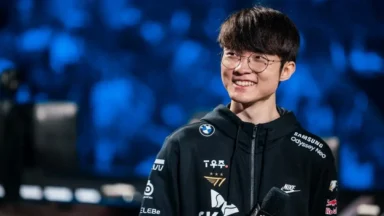 Smiling esports player in team jacket on stage