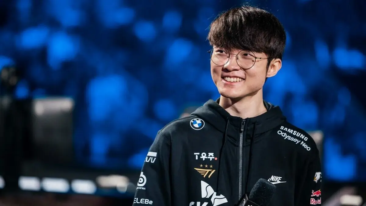 Smiling esports player in team jacket on stage