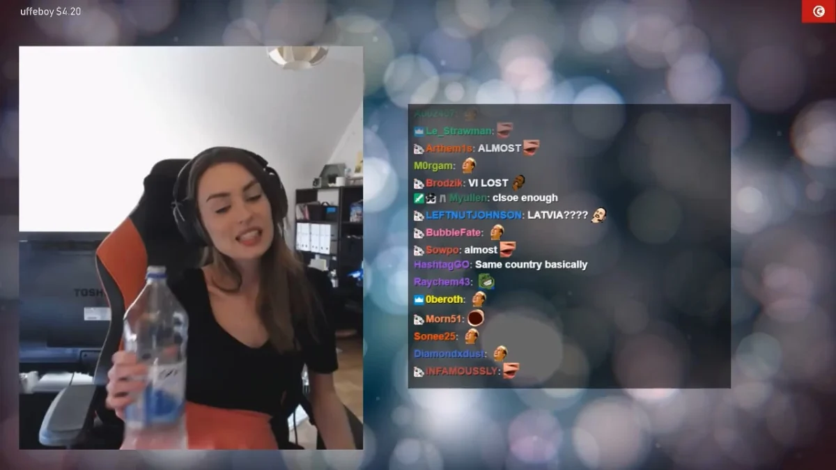 Streamer talking to chat while holding water bottle