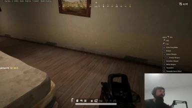 First-person shooter gameplay with player streaming video