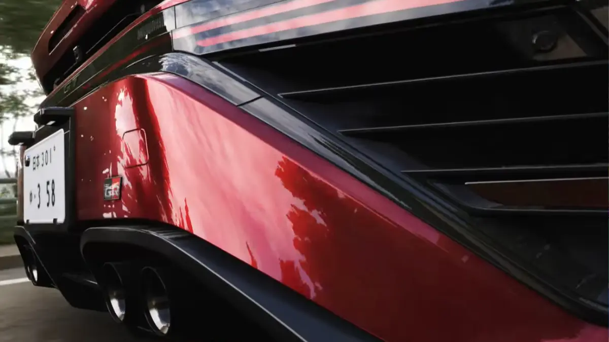 Close-up of red sports car rear bumper
