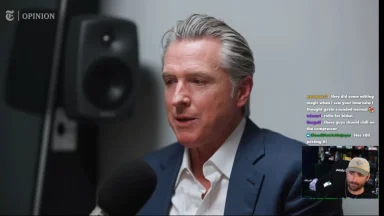 Man speaking into microphone during interview recording