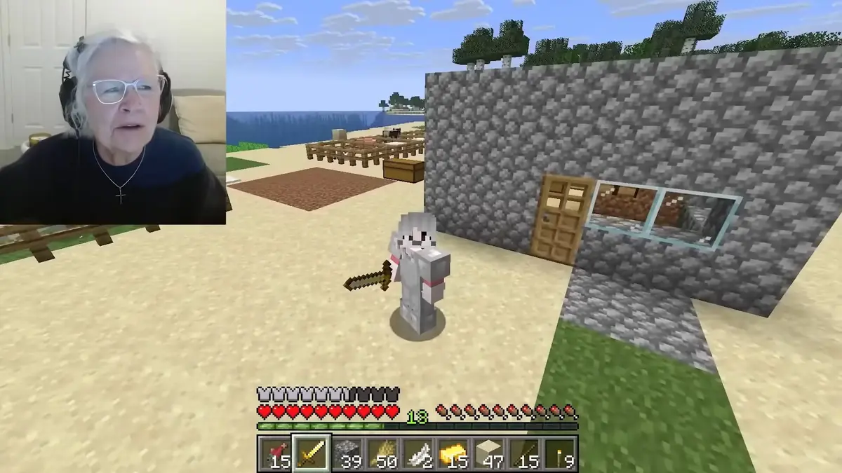 Woman streaming Minecraft gameplay with beach house build