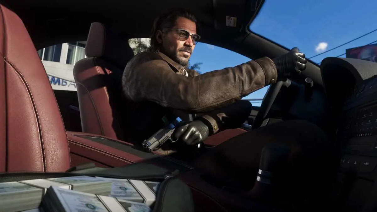 Man driving luxury car holding handgun beside cash